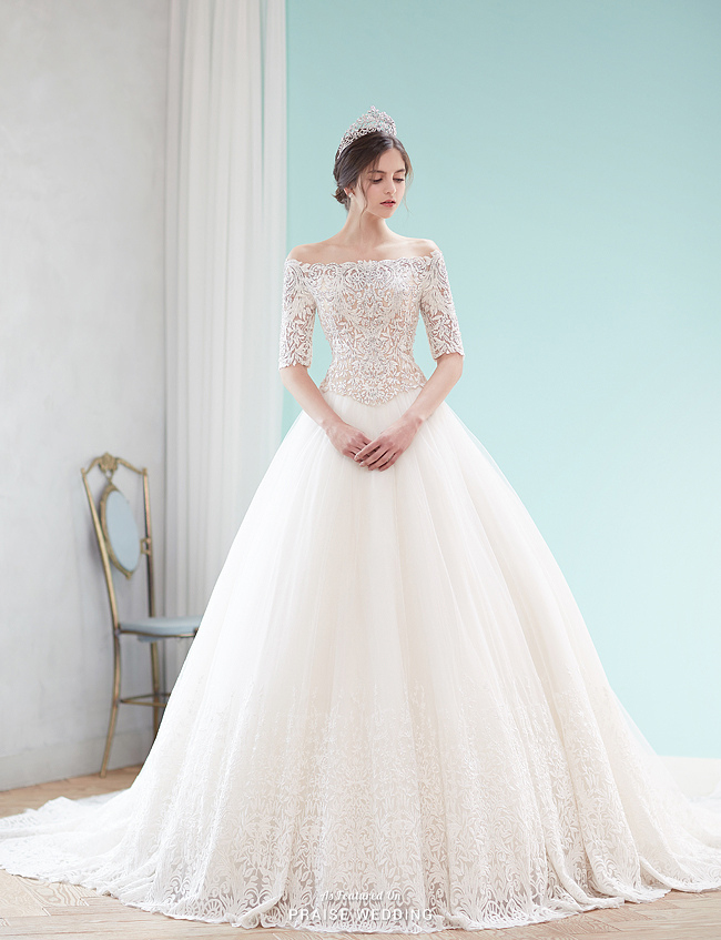 We can't resist this graceful gown from Lydia Bride featuring delicate detailing!