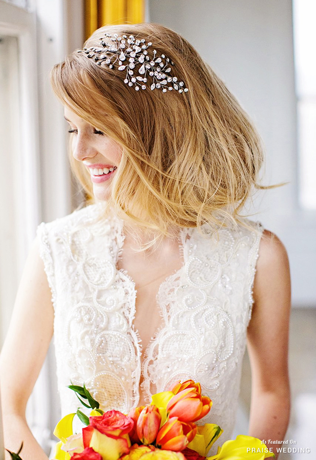 Crown your wedding day look with this enchanting headpiece featuring intricate floral spray of sparkling crystals!
