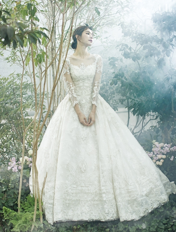 This wedding dress from Rose Rosa featuring elegant floral lace with long sleeves is so romantic!