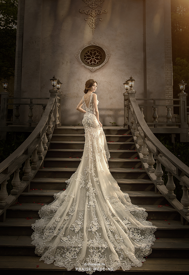 This classic laced gown from Catherine Wedding featuring a breathtaking long train is oh so charming!