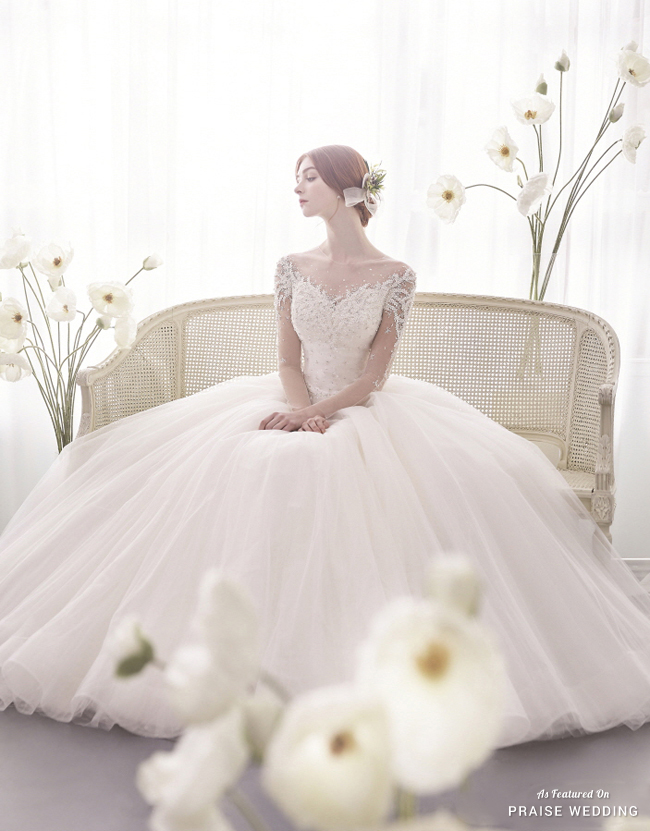 This dreamy wedding dress from J Sposa combining romantic embellishments and airy tulle is full of angelic charm!