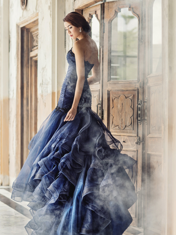 Blending a graceful feminine silhouette with luxurious detailing, this royal blue gown from Enya Mareine is a show stopper