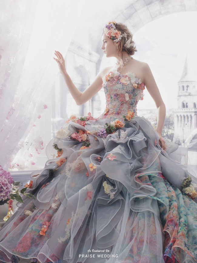 Stella de Libero presents this unique gray gown featuring 3D floral accents that create a romantic pop of color!