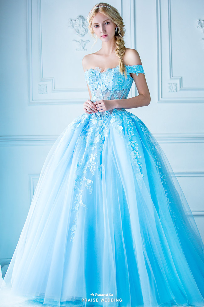A jaw-droppingly beautiful blue ball gown from Digio Bridal featuring unique floral accents!