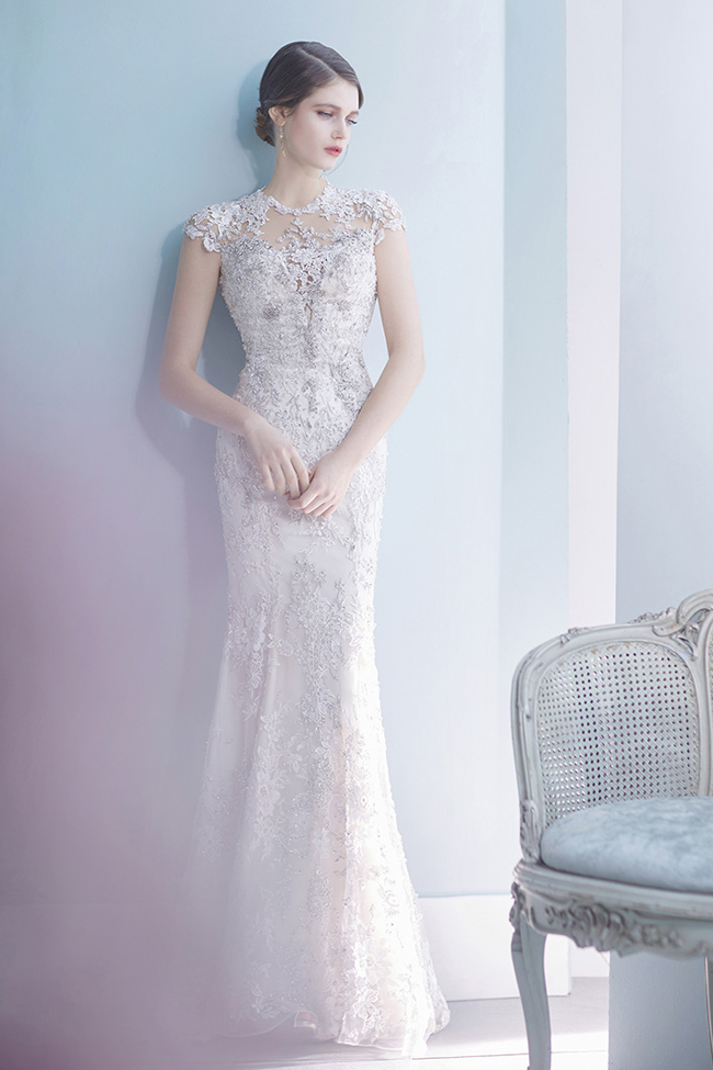 This fitted wedding dress from Ray & Co. featuring stunning jewel embellishments has captivated our hearts!