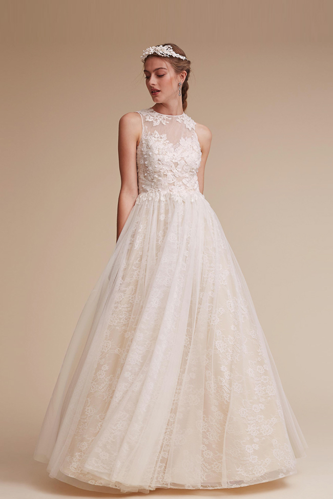 With a touch of Old World romance, this ivory ball gown from BHLDN featuring an illusion neckline, adorned with lace appliqué is shouting romance!