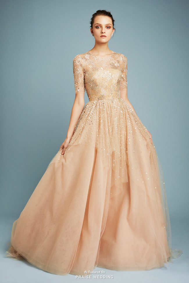 This golden gown from Reem Acra bursting with ultra-chic embelishments is a show stopper!