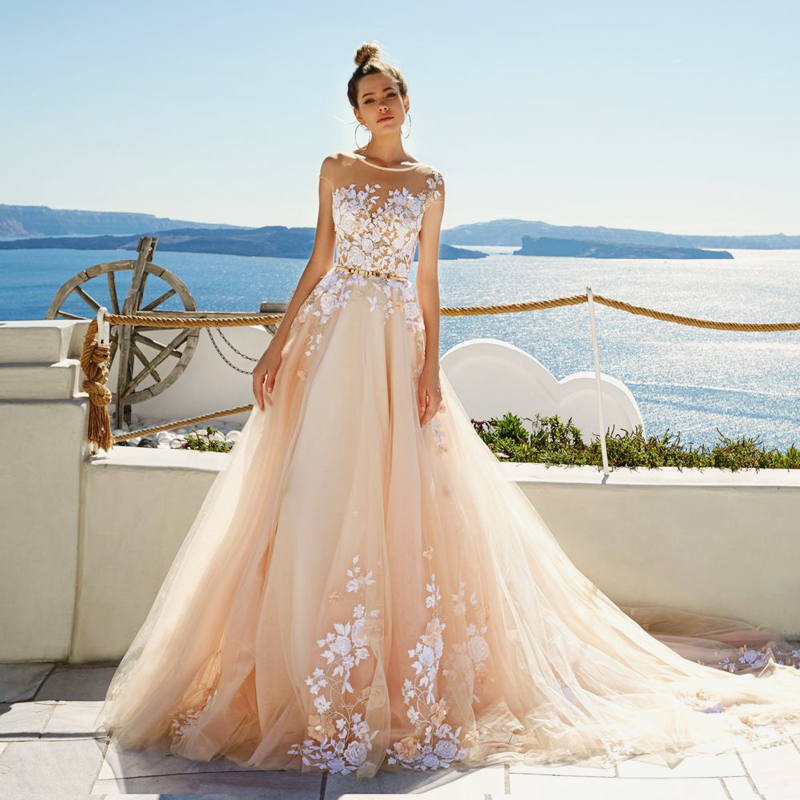 Eva Lendel presents this graceful blush gown featuring exquisite white floral embroideries! 