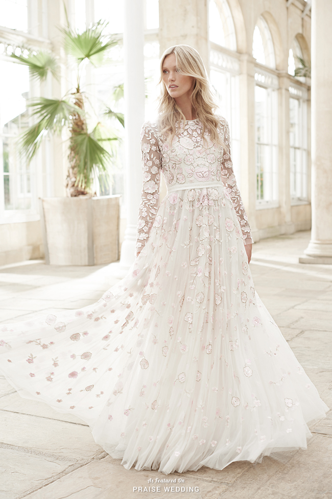 This ethereal wedding dress from Needle & Thread featuring chic floral embellishments illustrates romance with a trace of playfulness!
