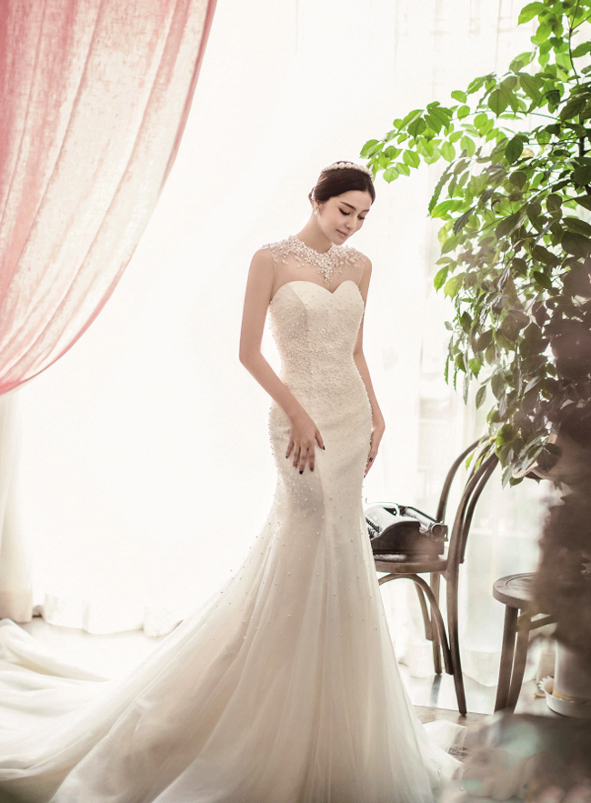 In love with this effortlessly beautiful gown from Tyche Wedding featuring an unique jewel-embellished neckline!