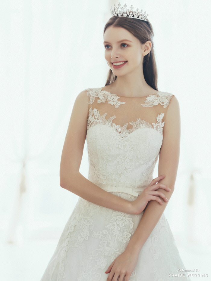 This graceful laced wedding gown from Cheramie is filled with classic ...