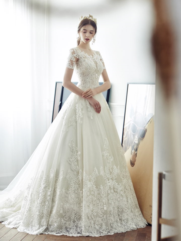 This romantic wedding gown from Nouvelle Mariee featuring delicate lace ...