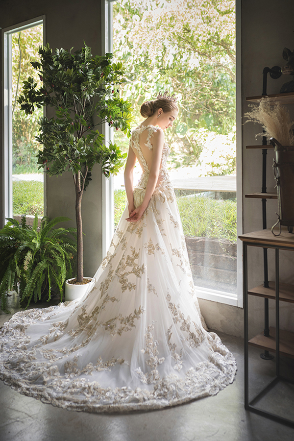 A romantic wedding gown from Ginger Wedding featuring delicate ...